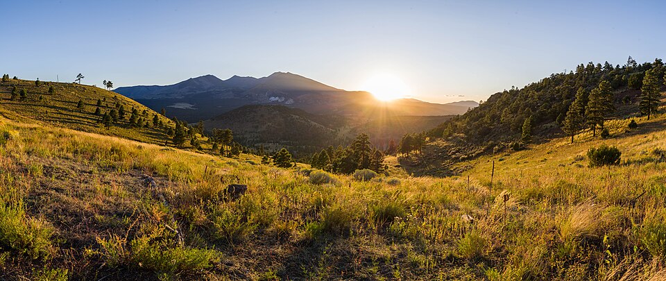 Sunset over the San Francisco Peaks and pine meadows near Flagstaff, Arizona